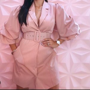 A stylish pink vest with a belt